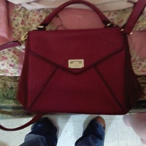 Red Satchel with Gold Hardware and Versatile Straps